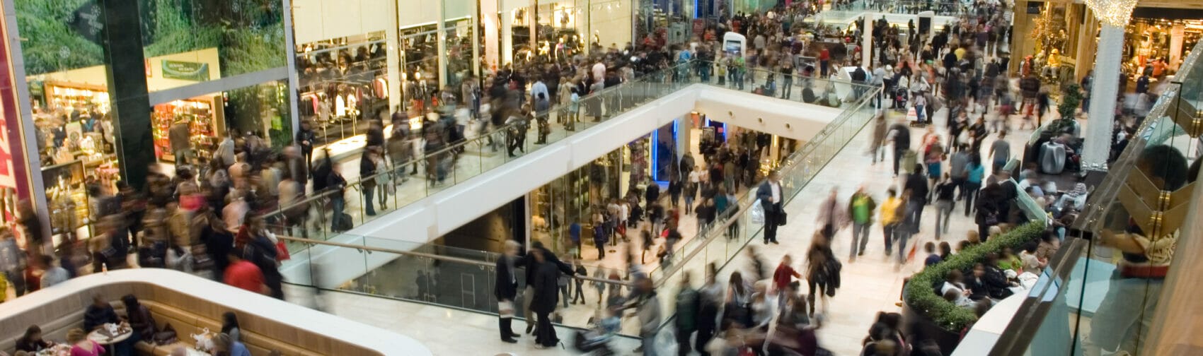 People in shopping mall looking for products to test.